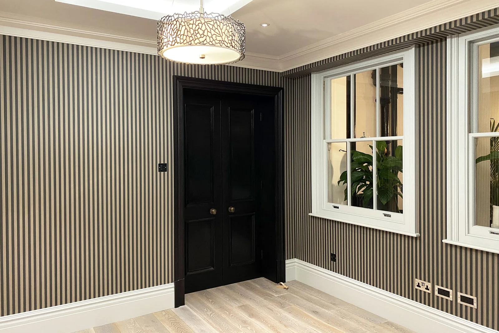 Traditional printed wallpaper installation